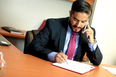 Professional discussing a financial matter by phone